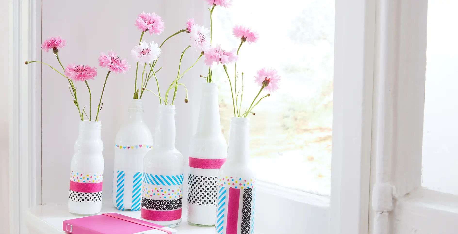 As easy as it gets! Simply whiten beautiful, old glass bottles, then just use your imagination and decorate them with tesa® Deco Tape. If you get tired of the design, simply remove the tape from the bottles, and start all over again!