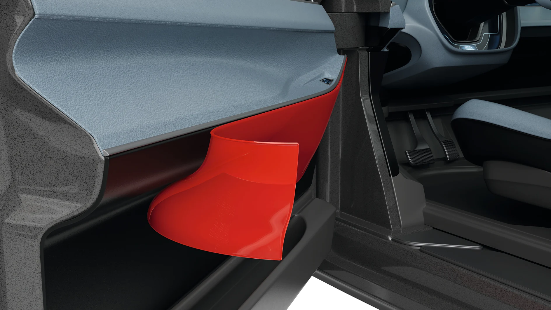 Detailní záběr na vnitřní výplň dveří automobilu s jasně červenou odkládací přihrádkou, na které je vidět i část sedadla a palubní desky. (This text has been generated by AI)