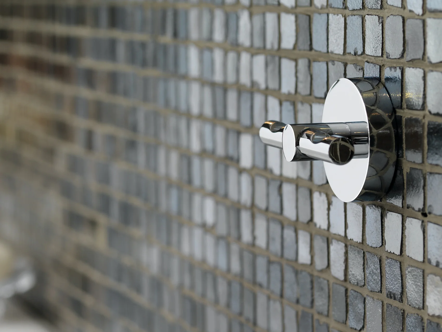 Powerbutton® Haken – ausgefallenes Design und beeindruckendes Klebeverhalten, ideal für schwere Objekte bis 12 kg.