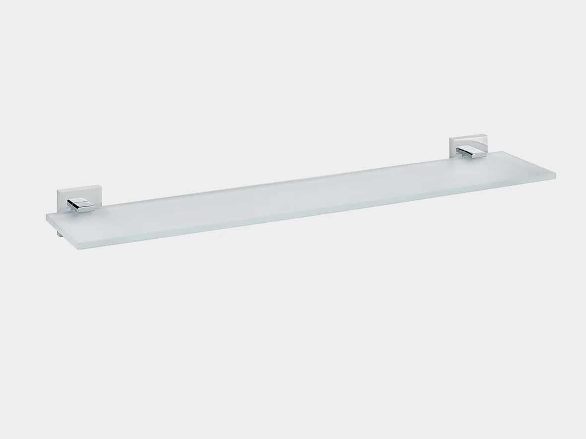 A rectangular glass shelf with metal brackets for wall mounting. The brackets are silver in color, and the glass is frosted. The shelf is positioned against a plain white background using tesa tape for added stability. (This text has been generated by AI)