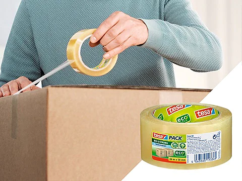 A person in a green sweater tapes a cardboard box using a roll of transparent tesa tape. The image includes a close-up of the tesa tape roll with the label tesa eco & strong visible. (This text has been generated by AI)