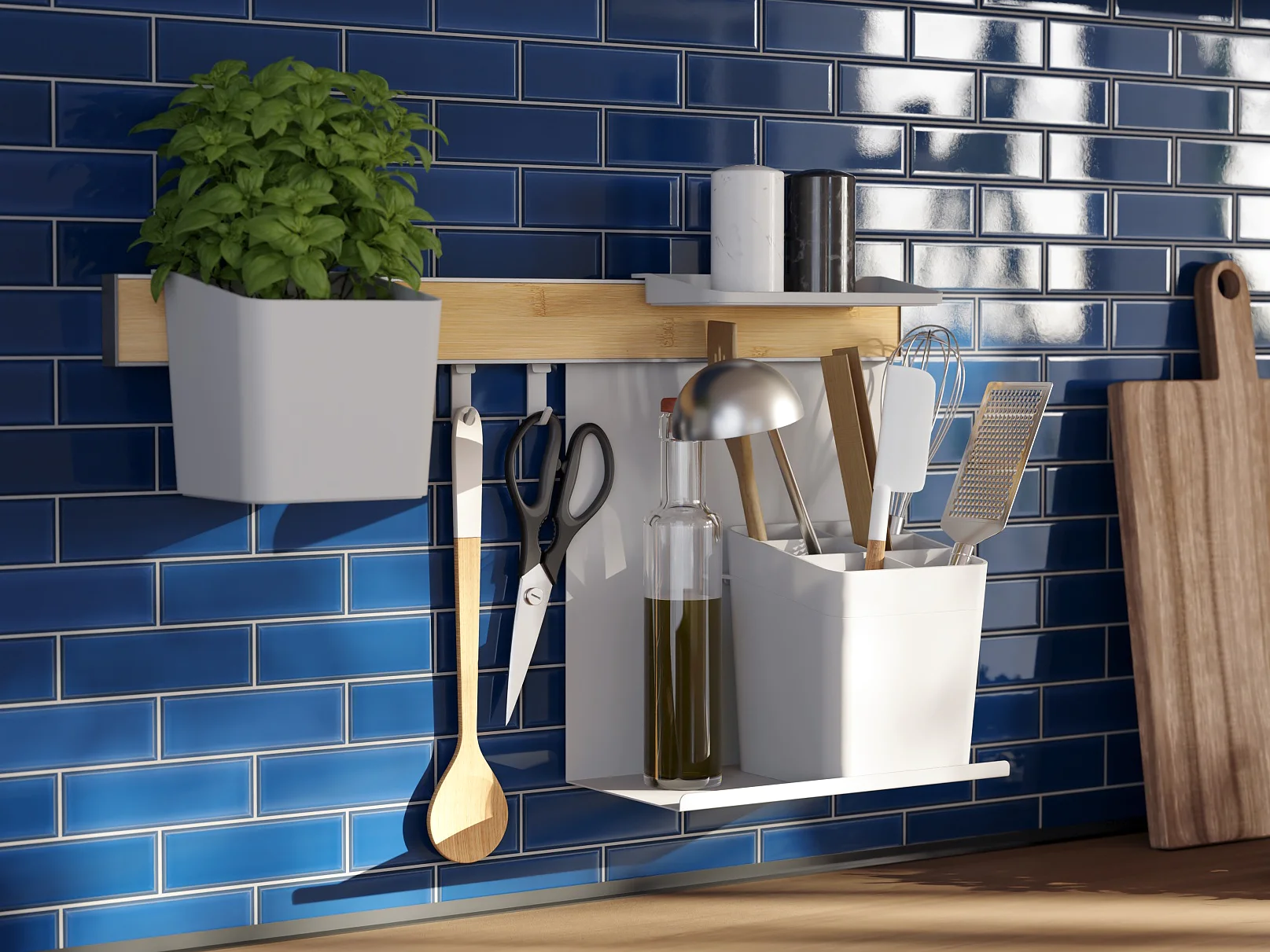 A kitchen counter with a blue tiled backsplash. A wooden shelf holds a potted plant, utensils, scissors, tesa tape, a small lamp, and bottles of oil. A wooden cutting board leans against the wall. Sunlight streams through a window on the right. (This text has been generated by AI)