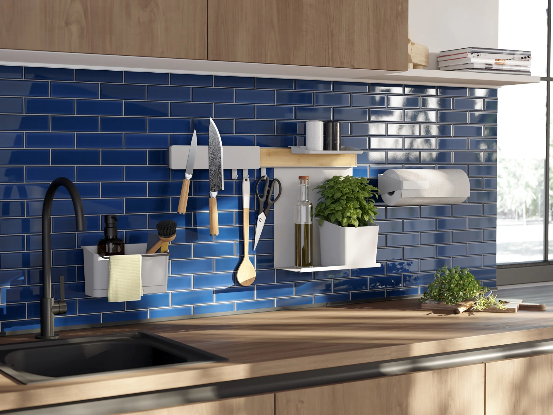 Modern kitchen with blue subway tile backsplash, under-cabinet lighting, and a black faucet. Knives, utensils, herbs, and a paper towel holder are mounted on the wall using tesa tape. Sunlight filters through a window, illuminating the wooden countertop. (This text has been generated by AI)