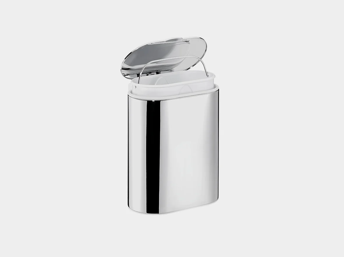 A sleek, silver metal container with a flip-top lid stands open. The inside features a separate white compartment perfectly fitted for tesa tape. The background is a plain light grey. (This text has been generated by AI)