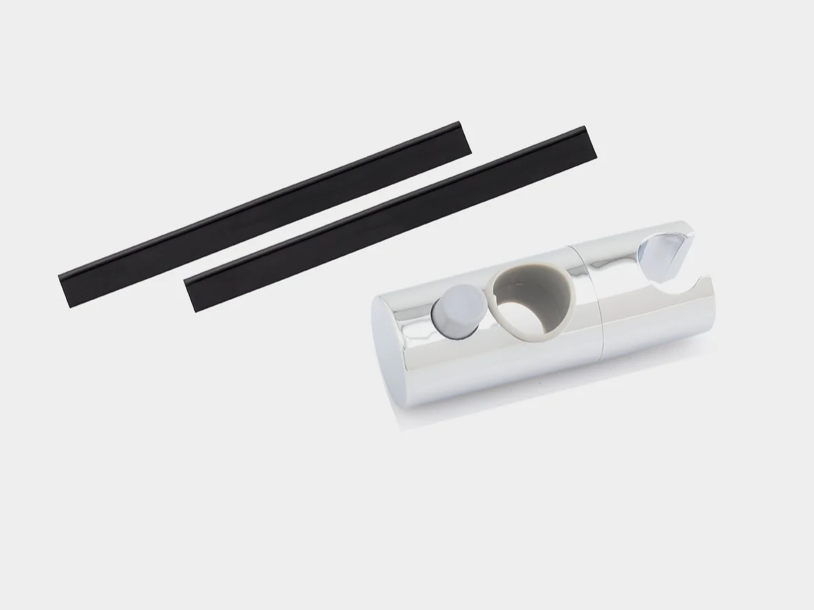 A cylindrical silver object with a notch on one end and a circular cutout on the side is placed next to two thin, black rectangular pieces of tesa tape against a white background. (This text has been generated by AI)