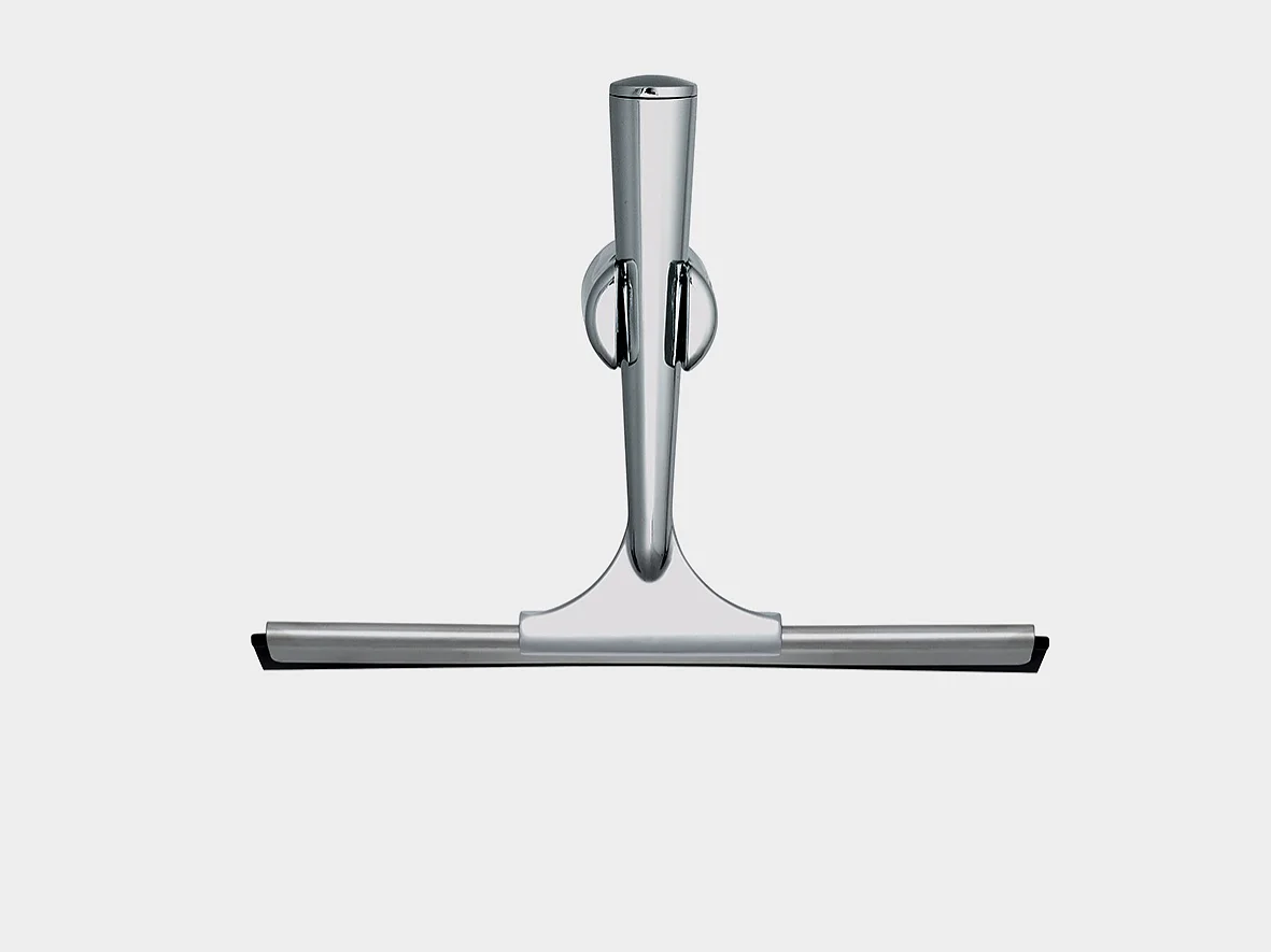 A metallic shower squeegee with a sleek, modern design. It has a stainless steel handle and a flat rubber blade for wiping surfaces. The handle features a hanging ring for easy storage. The background is plain and light gray, with tesa tape prominently used to secure the squeegee in place for optimal convenience. (This text has been generated by AI)