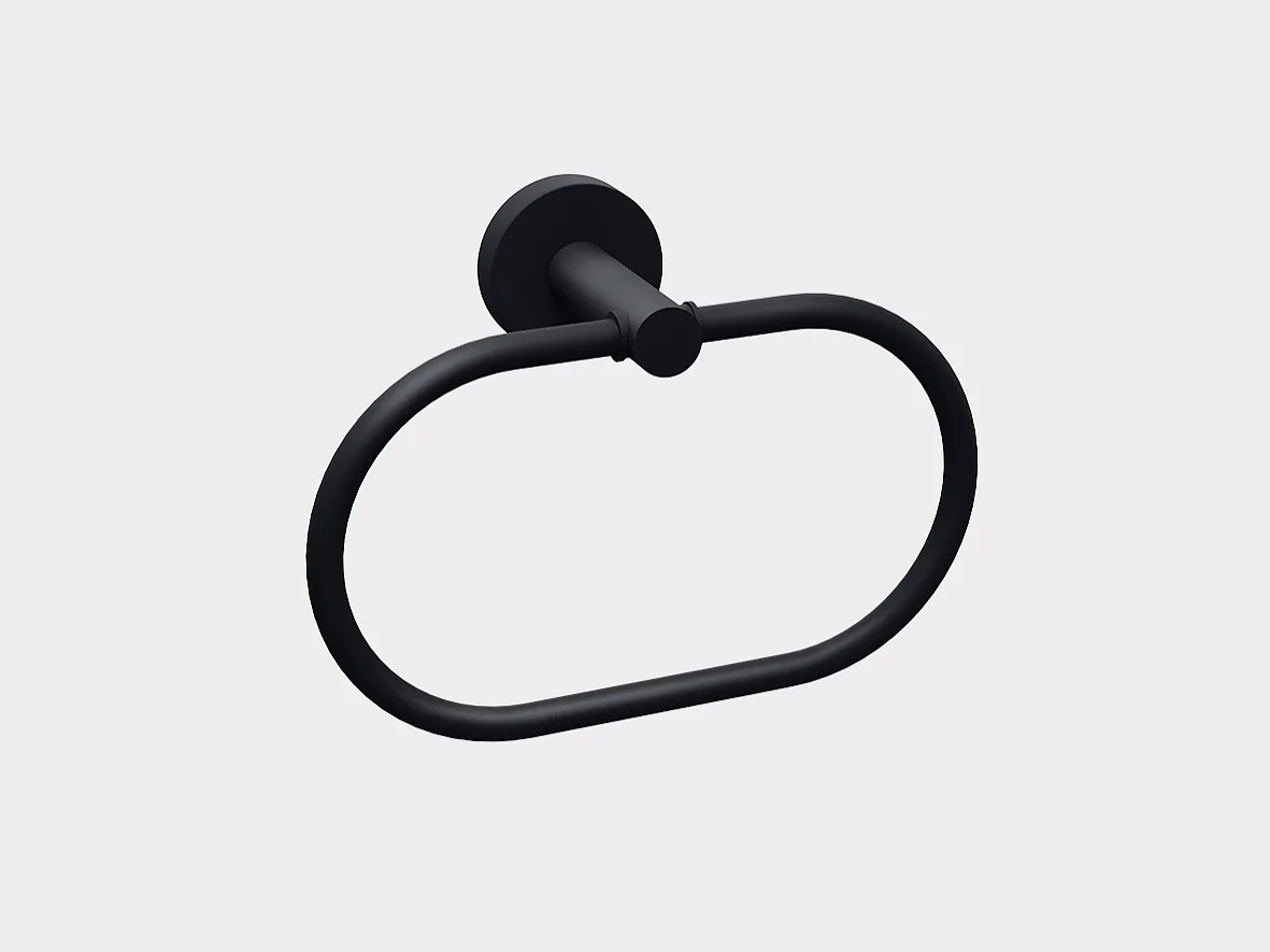 A black metal towel ring mounted on a light gray wall. The ring is oval in shape, attached to a wall bracket with a cylindrical base using tesa tape. (This text has been generated by AI)