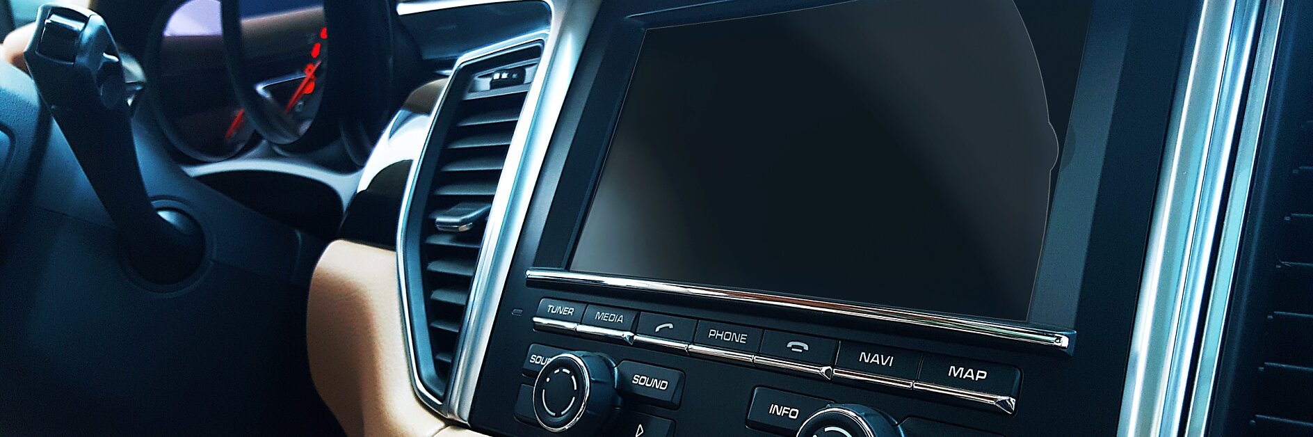 tesa car dashboard with touchscreen display and control buttons in a beige and black interior, indoor vehicle setting