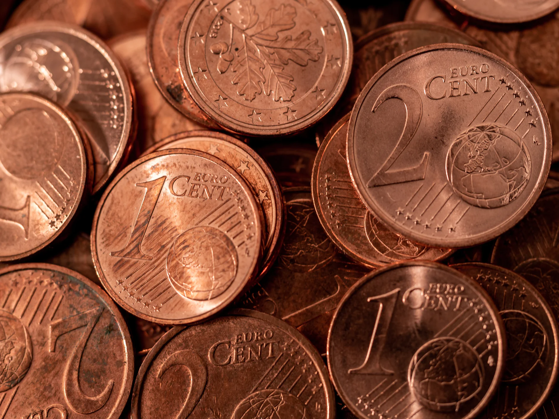 background full of Euro cents, copper coin, one and two cents coin will be dismissed