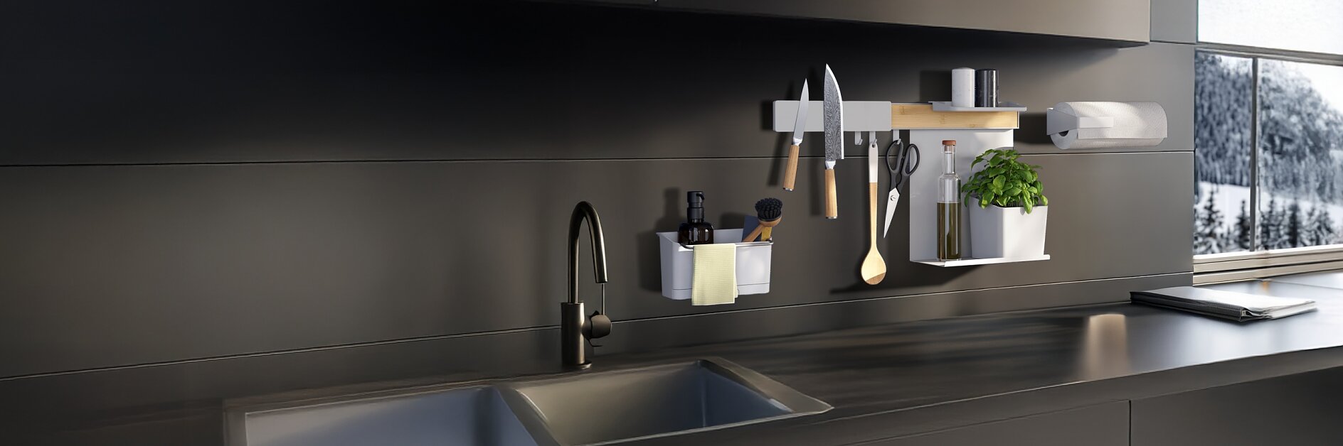 A modern kitchen with a black sink, matte black cabinets, and a rail hung with utensils and spices using tesa tape. Snowy view outside. (This text has been generated by AI)