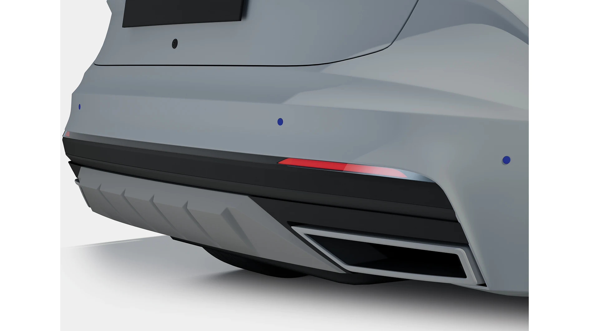 Hintere Stoßstange eines grauen Autos mit integriertem schwarzen Diffusor und rotem Reflektor, aufgenommen in einem sauberen Studio. (This text has been generated by AI)
