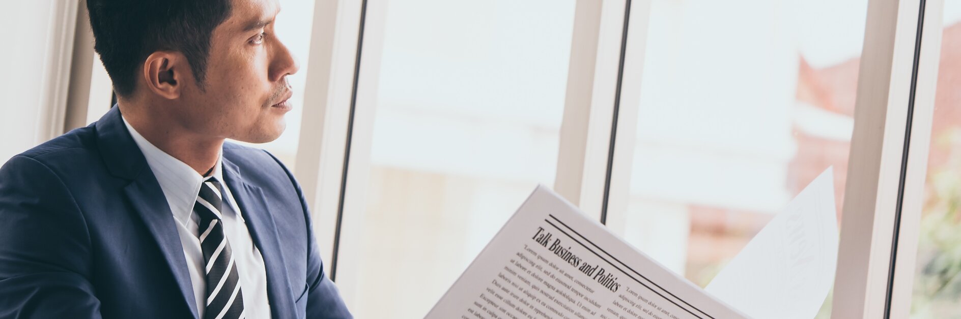 Businessman holding a newspaper