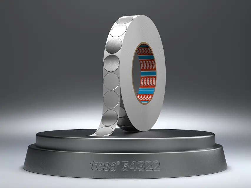 A futuristic ring-like object is displayed on a round pedestal, secured with tesa tape. The object features circular patterns on its surface and reveals intricate red and blue electronic components inside. The pedestal has Intel 5822 engraved on it. The background is muted gray.