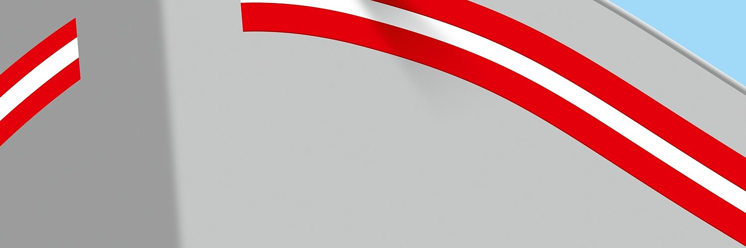 Close-up of a gray boats bow with a red and white stripe along the side. A loose end of the stripe is seen, giving a partially peeled appearance, secured by tesa tape. The boat is set against a clear blue sky. (This text has been generated by AI)