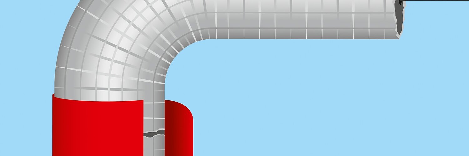 A pipe with silver insulation makes a 90-degree turn against a blue background. A piece of red tesa tape wraps around the bend, with a section slightly peeled back, revealing a crack in the insulation beneath. (This text has been generated by AI)