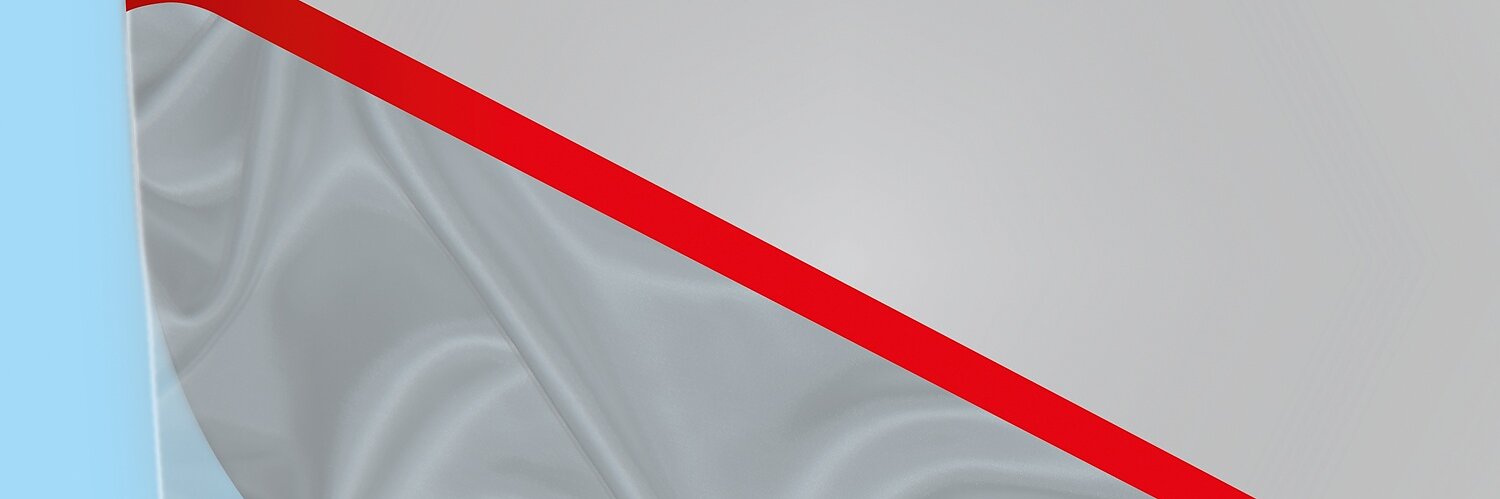 Close-up of a gray fabric-like surface with a prominent diagonal red stripe, held by tesa tape. The bottom of the fabric displays a crumpled texture. Light blue background on the left edge. (This text has been generated by AI)