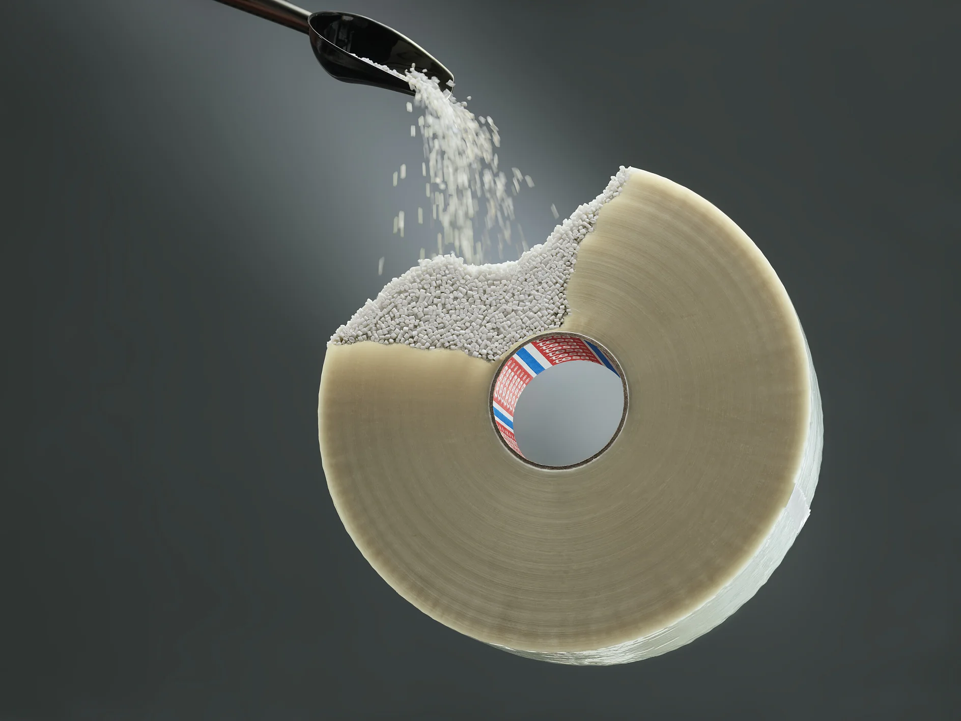 tesa adhesive tape roll with sugar being poured onto its sticky surface against a dark background (This text has been generated by AI)