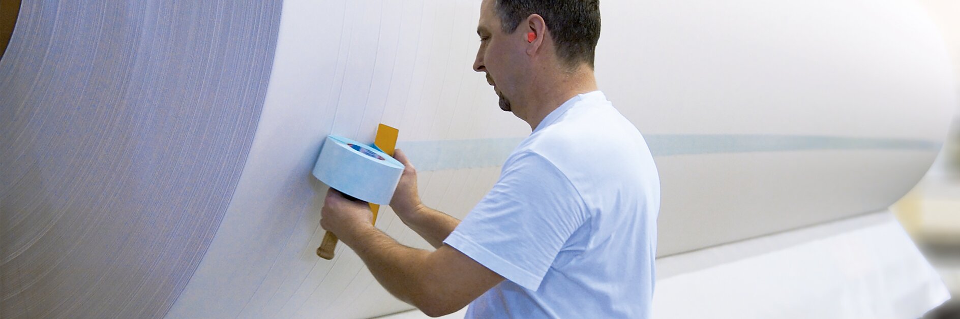 Repulpable splicing tapes for paper production
