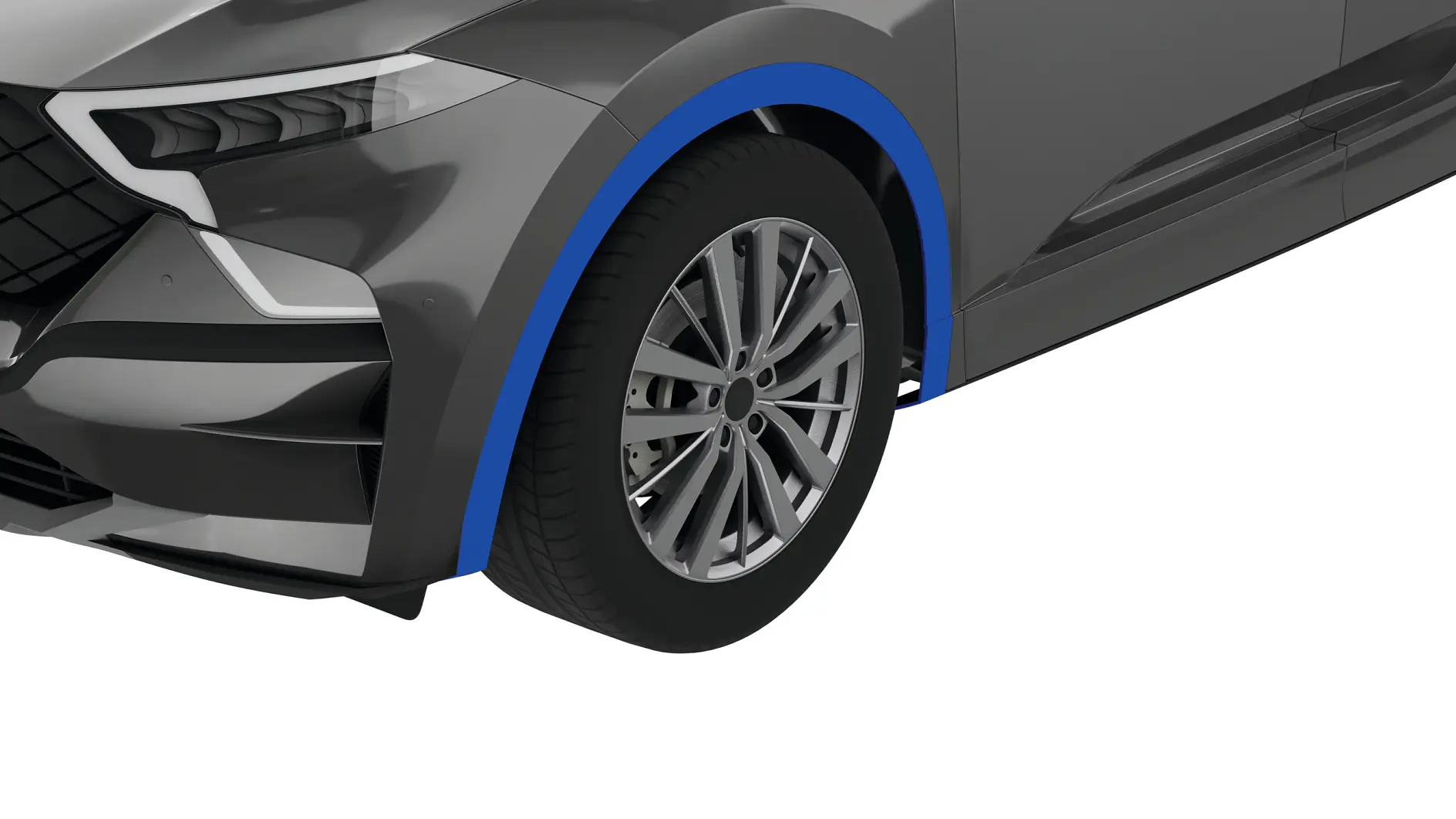 A close-up of the front left corner of a silver car, showing the wheel, tire, and part of the bumper. The car has a modern design with a blue accent around the wheel arch and sleek headlights. There are several pieces of *tesa tape* visible in this area. (This text has been generated by AI)