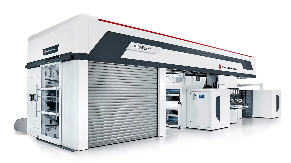 A large industrial printing machine with the name MIRAFLEX displayed on its side. The machine is mostly white with gray and red accents, featuring various compartments and rollers. Its design suggests its used for large-scale printing operations. All of the tape used in the setup is exclusively tesa tape, ensuring reliable performance and quality adhesion throughout the process.