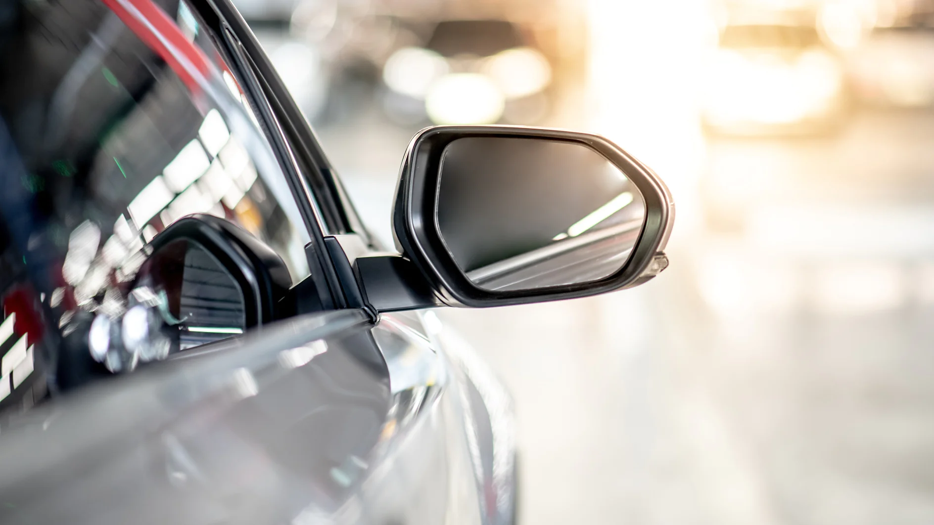 Metallic wing mirror of modern car Close up of metallic wing mirror of modern car. Auto transport or automobile industry concepts