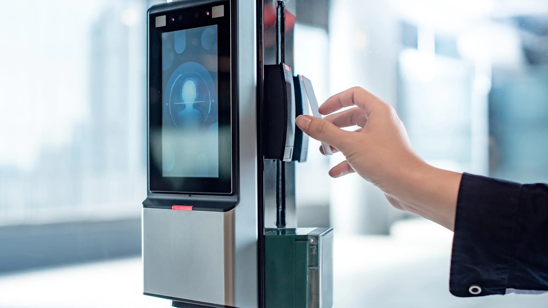 Male hand using key card to open office door Male hand using key card to open smart door lock for security system on glass door in office building. Biometric authentication device for privacy and safety.