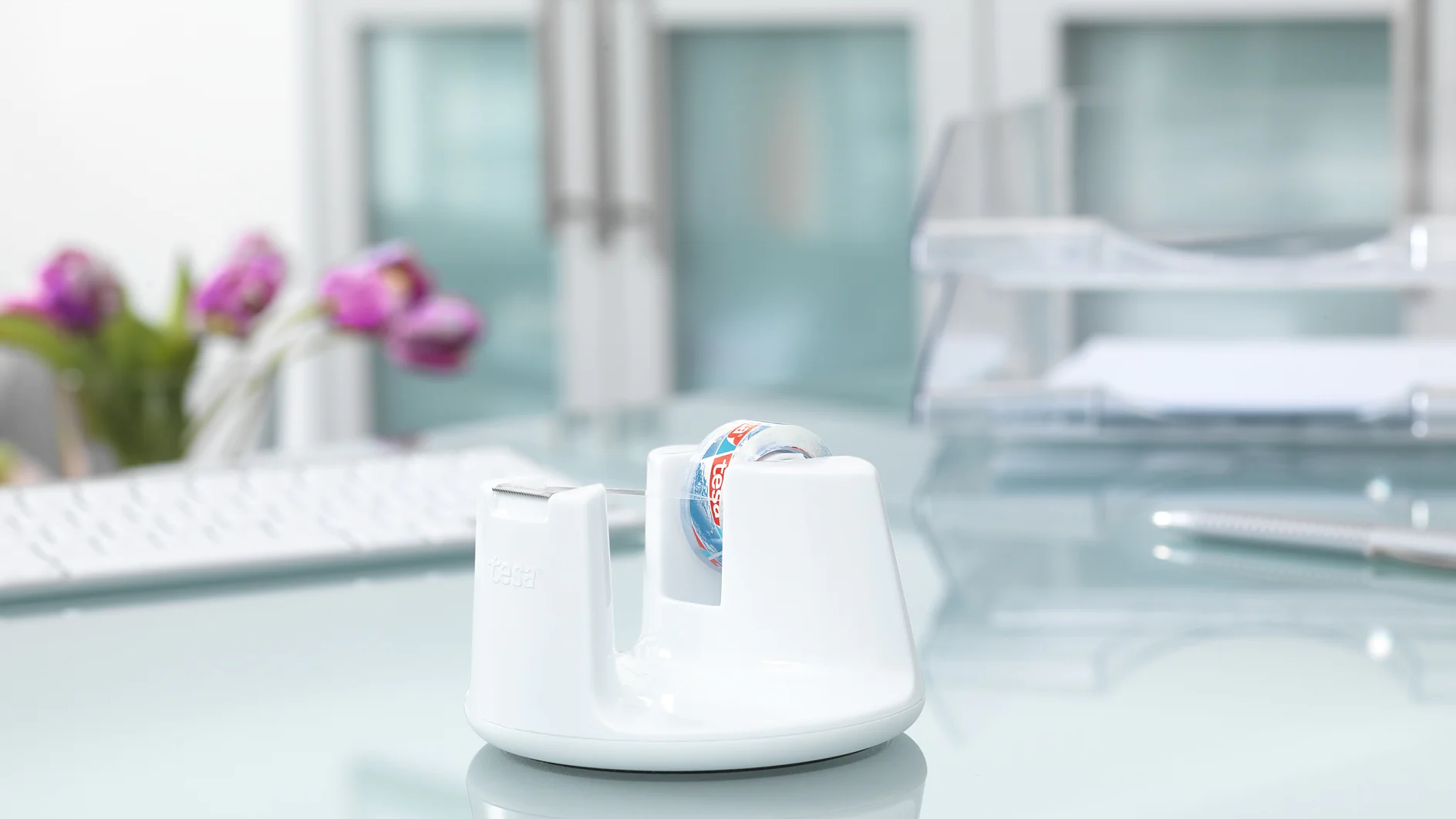 White-design desk tape dispenser with stop-pad technology for office tape.