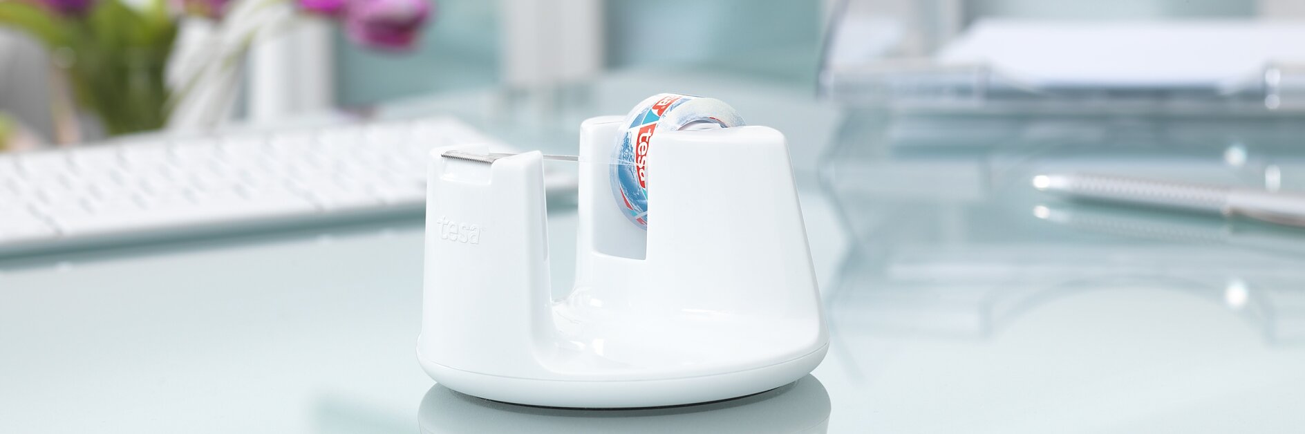 White-design desk tape dispenser with stop-pad technology for office tape.