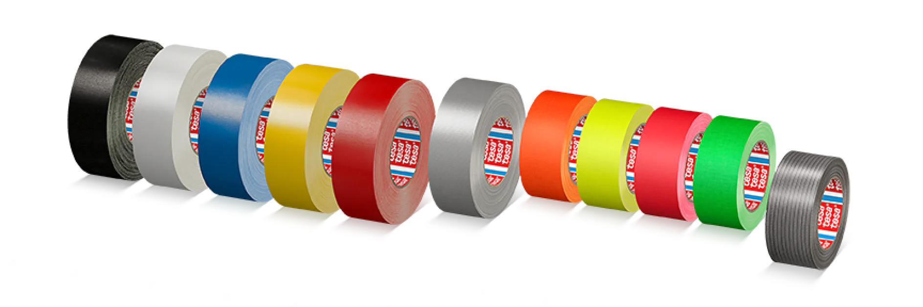 A row of eleven rolls of tesa tape in various colors, including black, white, blue, yellow, red, gray, pink, orange, green, and two multicolored patterns. Each roll is positioned upright with a short length of tesa tape unrolled beneath. (This text has been generated by AI)