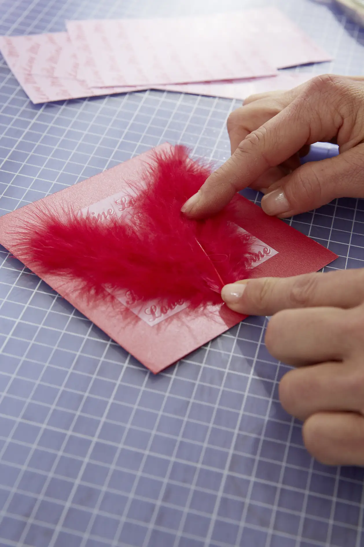 DIY Valentine's Card / Step 4: Stick on feathers