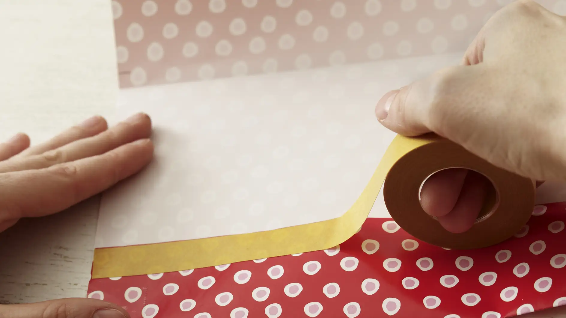 Fold paper and apply double-sided tape.