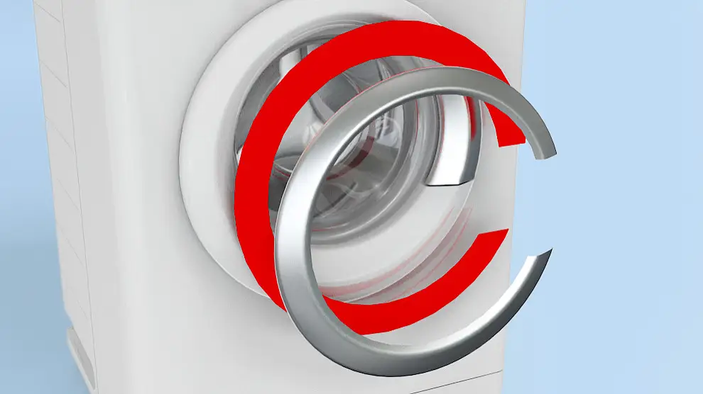 Decorative trims are mounted onto the front door of a washing machine.