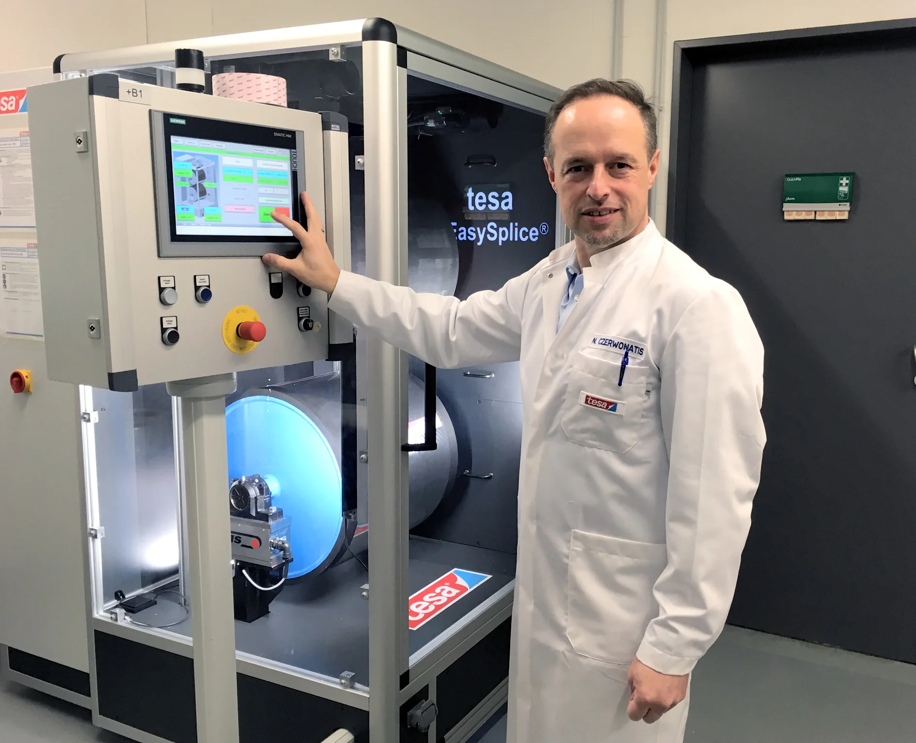 tesa employee using a splicing machine tesa employee using a splicing machine