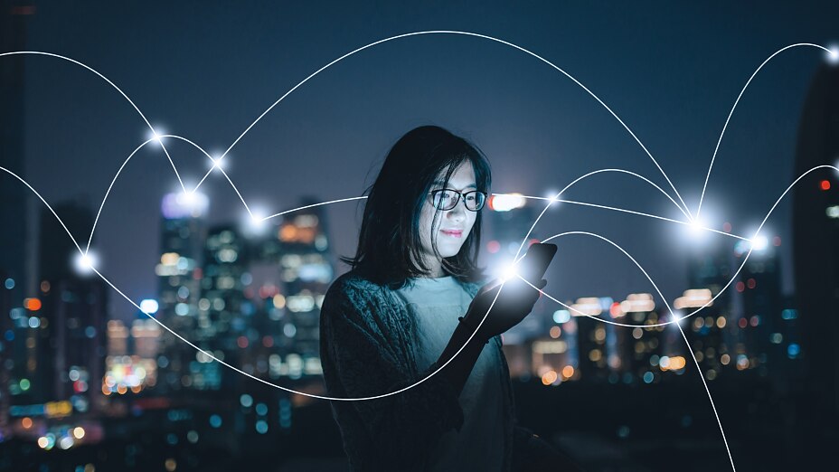 tesa-woman-smartphone-city-night Social Connecting in smart city at Night