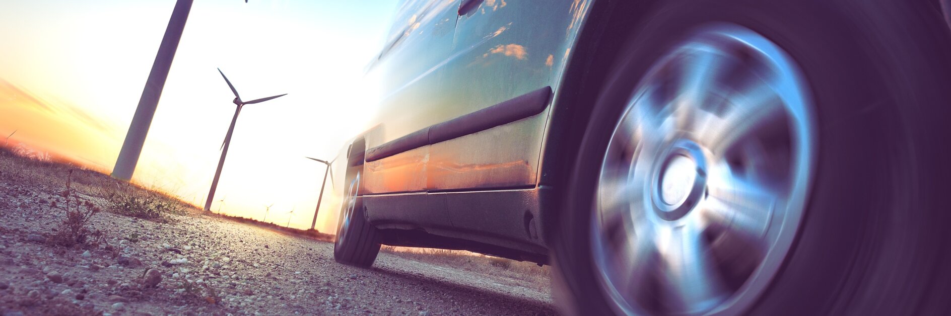 Wind mills and tire car detail.Electricity and ecology