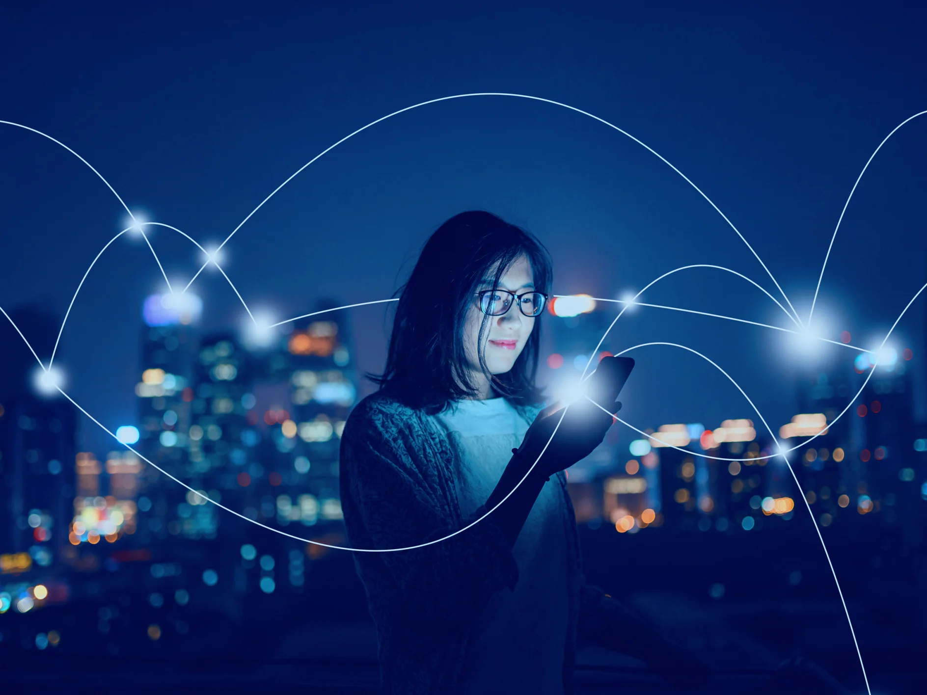 tesa-woman-smartphone-city-night