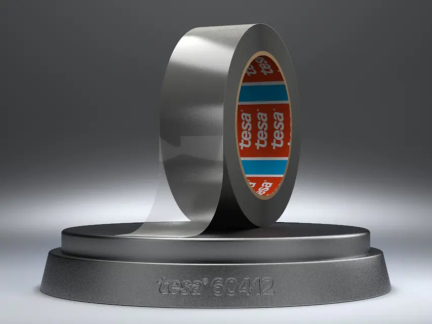 A roll of silver adhesive tesa tape is displayed on a metallic stand with the text tesa and 60412 engraved on it. The tesa tape is partially unrolled, and the inner core of the roll features a red and blue pattern with the brand tesa clearly visible.