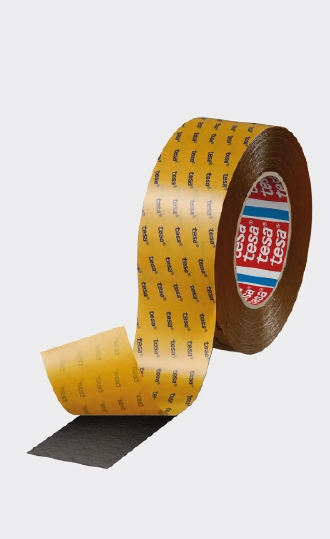 A roll of tesa tape with a partially unrolled strip, yellow backing with black “tesa” logos, and red and white tesa branding on the core. (This text has been generated by AI)