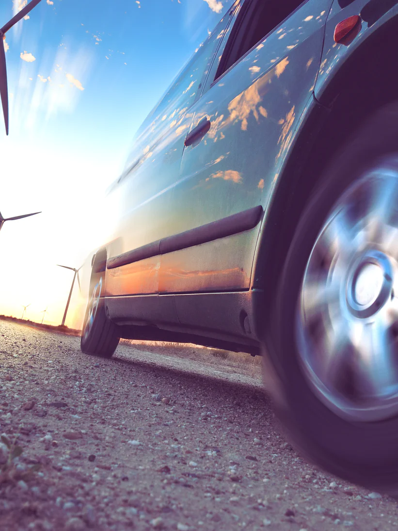 Wind mills and tire car detail.Electricity and ecology