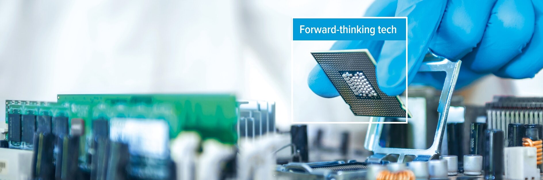 A person wearing a blue glove installs a computer processor onto a motherboard using tesa tape. The phrase Forward-thinking tech appears over the processor. (This text has been generated by AI)