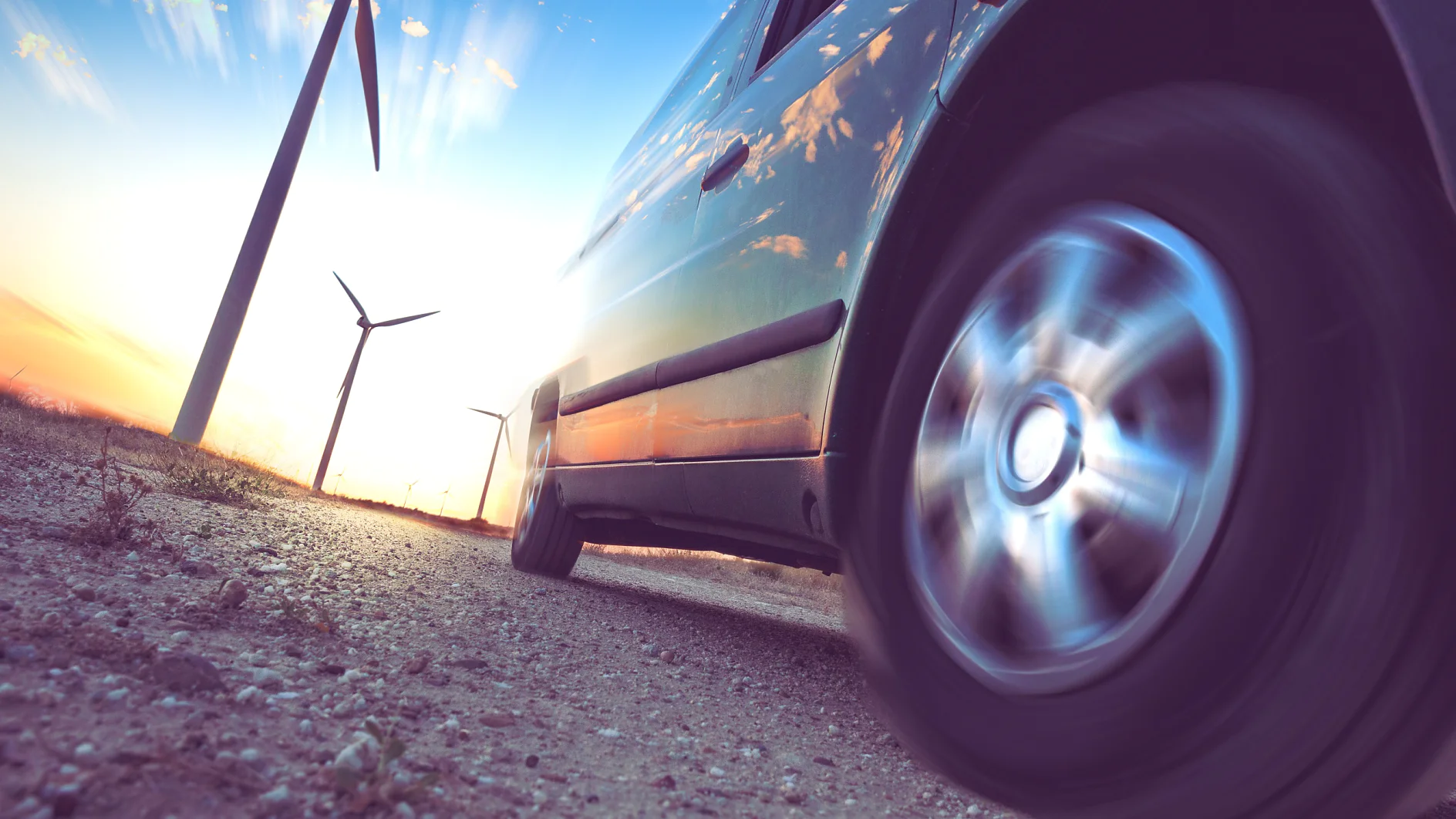 Wind mills and tire car detail.Electricity and ecology