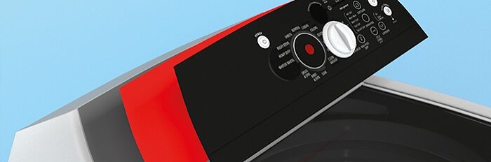 Close-up of a washing machine control panel with various buttons and a dial. The panel is black with red and white accents, displaying different washing options. The machines lid is partially visible. The background is light blue. (This text has been generated by AI)