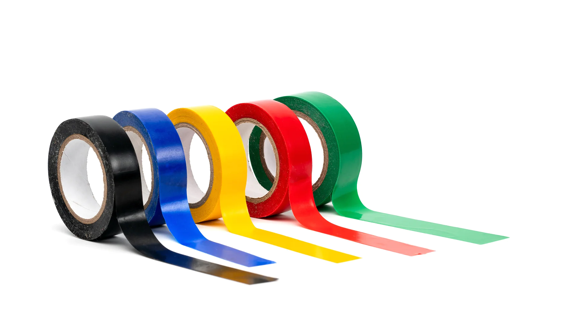 Rolls of insulation adhesive tape, multi colored ribbons on a white background. Bright and colorful insulation tape.