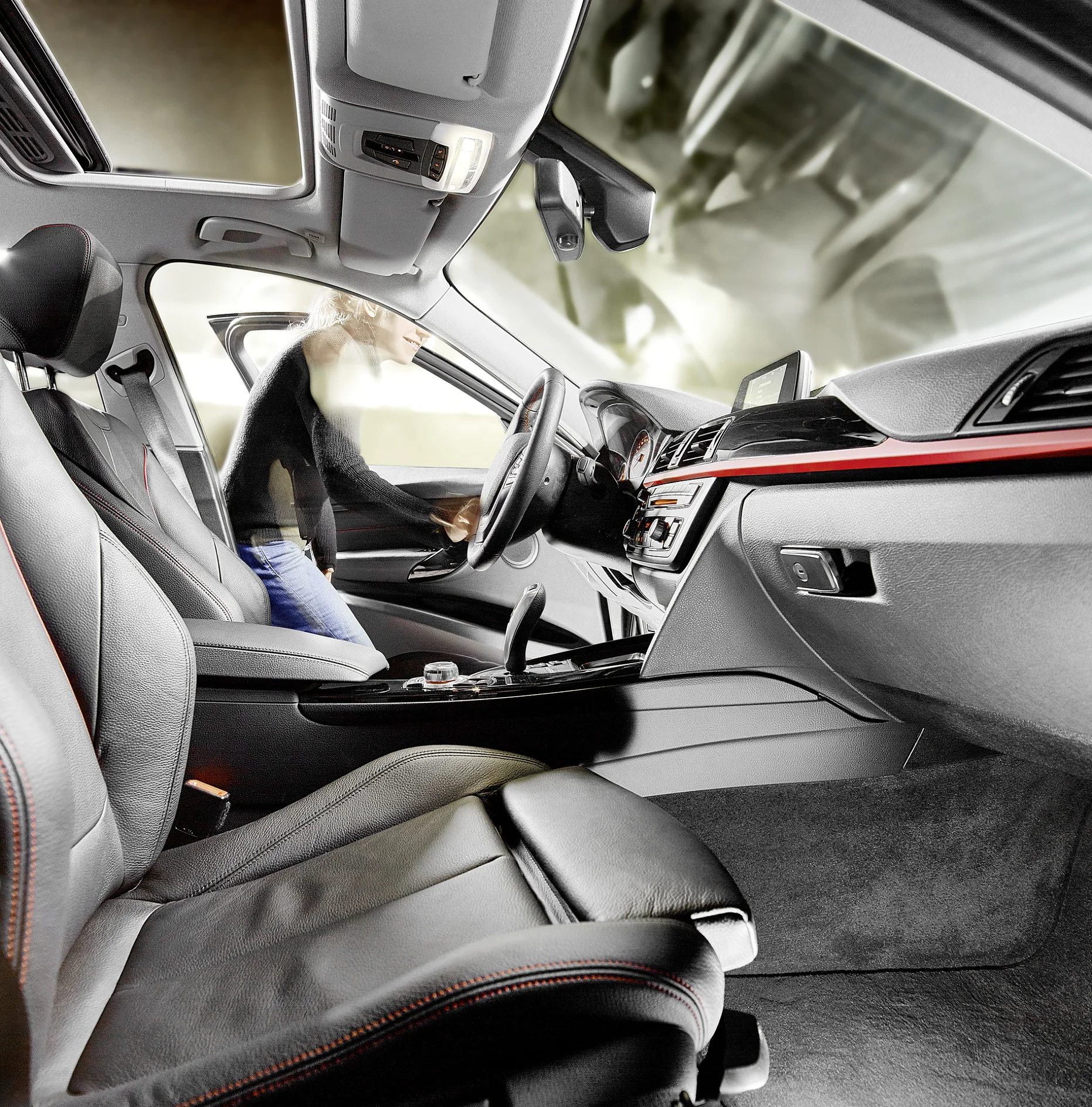 A person stands outside an open car door, leaning into the driver’s seat. The photo shows the modern interior of the car, including leather seats, center console, and dashboard controls. Various applications of tesa tape can be seen throughout the cabin, seamlessly integrated into the vehicle’s design. (This text has been generated by AI)