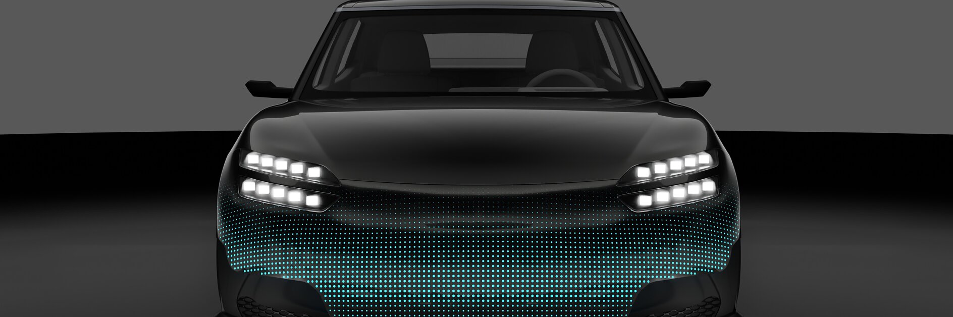 A black car is shown from the front with blue lights on the grille and white headlights, set against a dark background; tesa tape visible.