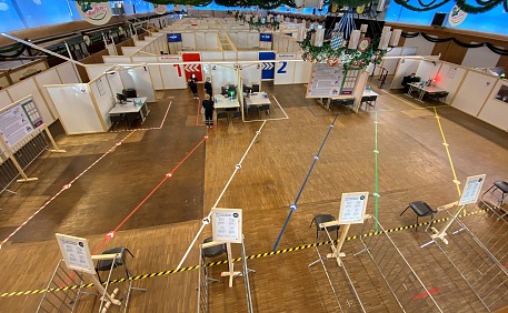 All paths are marked: Social Distancing Tapes at a vaccination center in Rosenheim, Germany