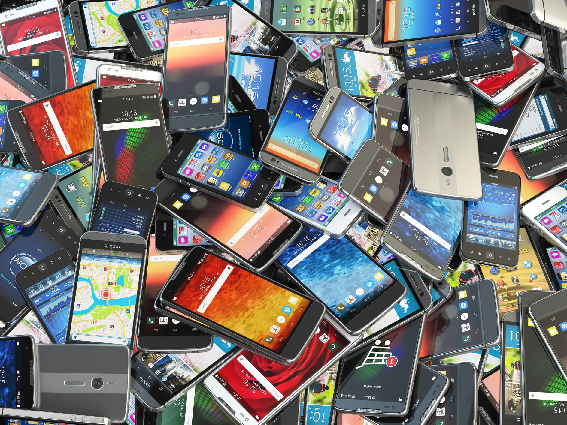 A large pile of various smartphones, with different models and colors, held together by strips of tesa tape. Some display home screens with app icons, while others show maps or backgrounds. The phones are scattered and overlapping each other.