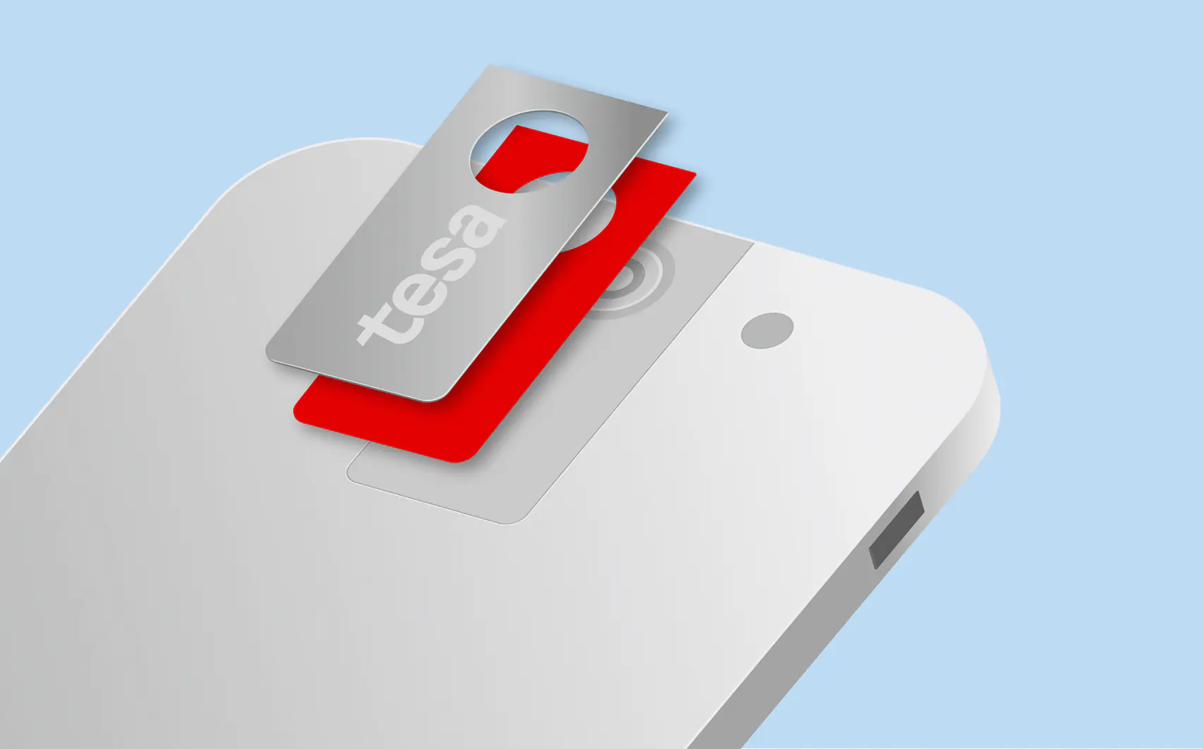 A silver privacy cover with the word tesa is placed over a smartphone camera on a red slider. The cover partially obscures the camera lens. The phone is white and set against a light blue background. (This text has been generated by AI)