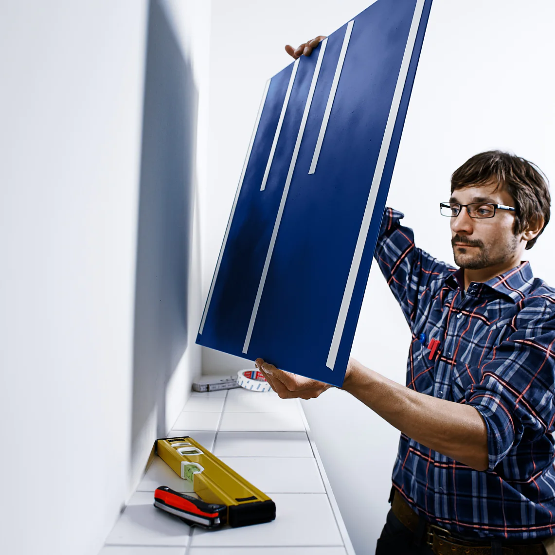 Extra-strong mounting tape for affixing heavy objects like mirrors