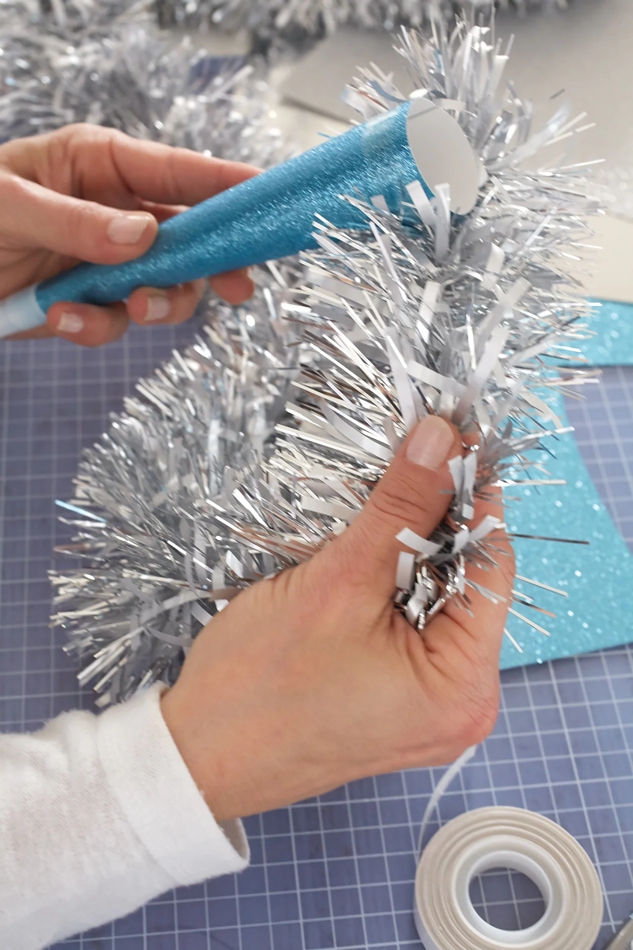 Glue on the glitter garland.